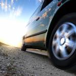 Car on road, symbolizing difference between negligent and reckless driving.