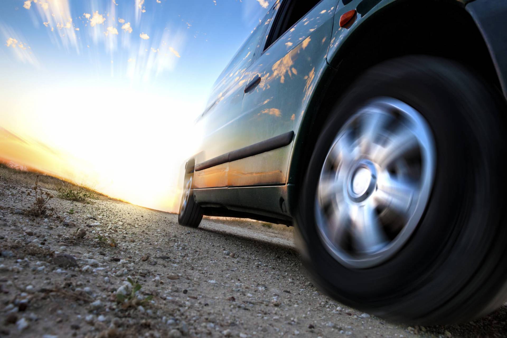 Car On Road Symbolizing Difference Between Negligent And Reckless Driving 